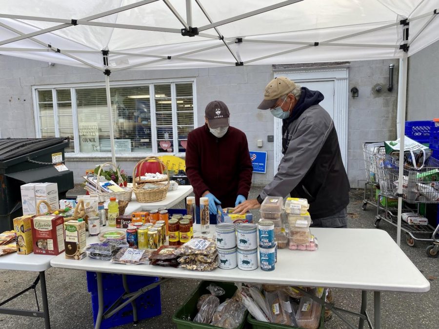 Volunteers prepare to serve clients outside the food bank. The Woodbury Food Bank, October 3, 2020, 8:49 a.m., (from left to right) Tony Mongillo and Mark Vaghi.