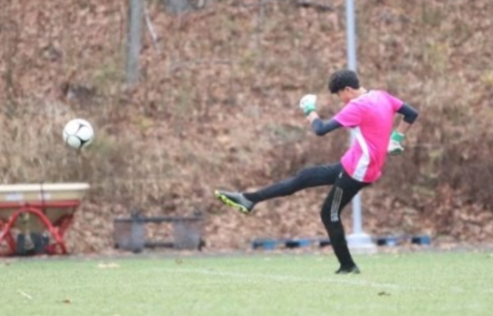 Nonnewaug boys soccer goalie Dylan Chung punts the ball after making a save during a game earlier this season. It was Chungs first season with the Chiefs after transferring from Canterbury.