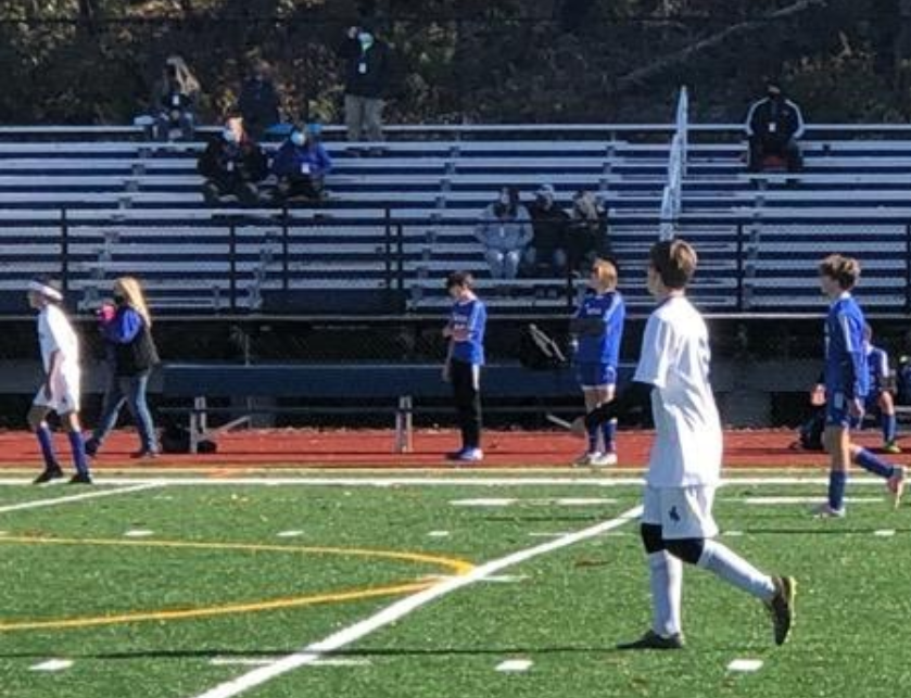 The bleachers at Nonnewaugs turf field were sparsely populated with fans this fall, as shown at a boys soccer game in October.