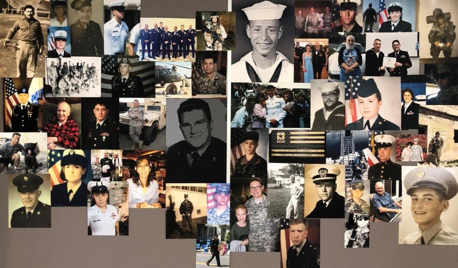 Photos of U.S. veterans with connections to Nonnewaug hang on a bulletin board outside the auditorium to honor their service.