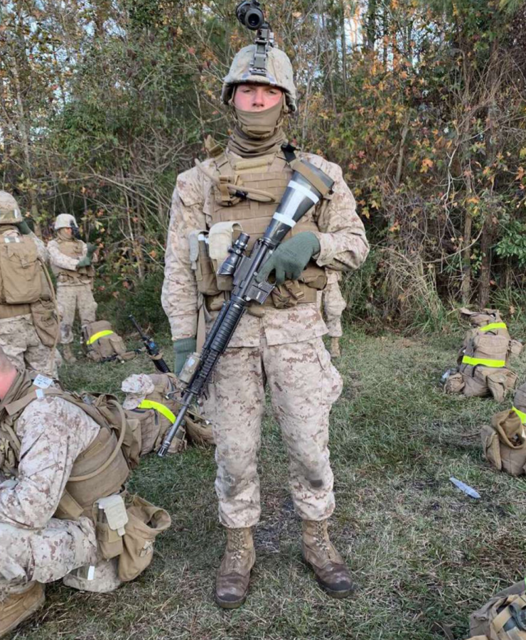 Jack Cronin, a 2020 Nonnewaug graduate, prepares his weapon for shooting qualifications last year at Camp Lejeune, North Carolina. Cronin is a combat engineer who enlisted for four years of active duty with the U.S. Marines.