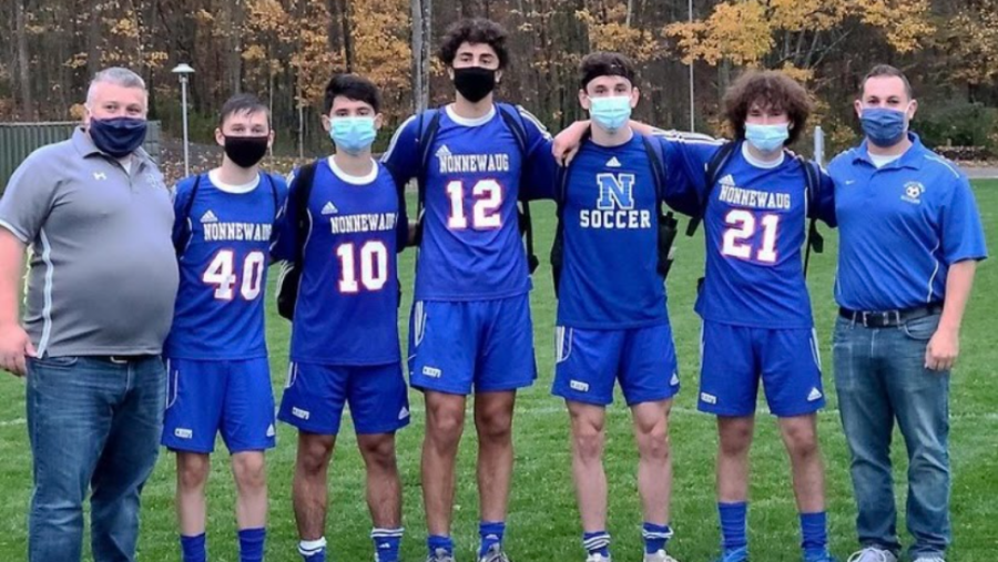 Nonnewaug+athletes+and+coaches%2C+including+those+pictured+on+the+boys+soccer+team%2C+were+used+to+wearing+masks+on+the+sidelines+in+the+fall+--+but+basketball+players+will+have+to+wear+masks+while+playing+this+winter.