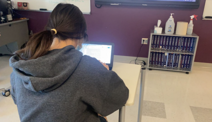 Sierra+St.+George+works+on+her+Chromebook+during+class+Jan.+25.+Most+Nonnewaug+students+have+returned+from+all-remote+learning%2C+but+Chromebooks+are+still+a+staple+of+classes.