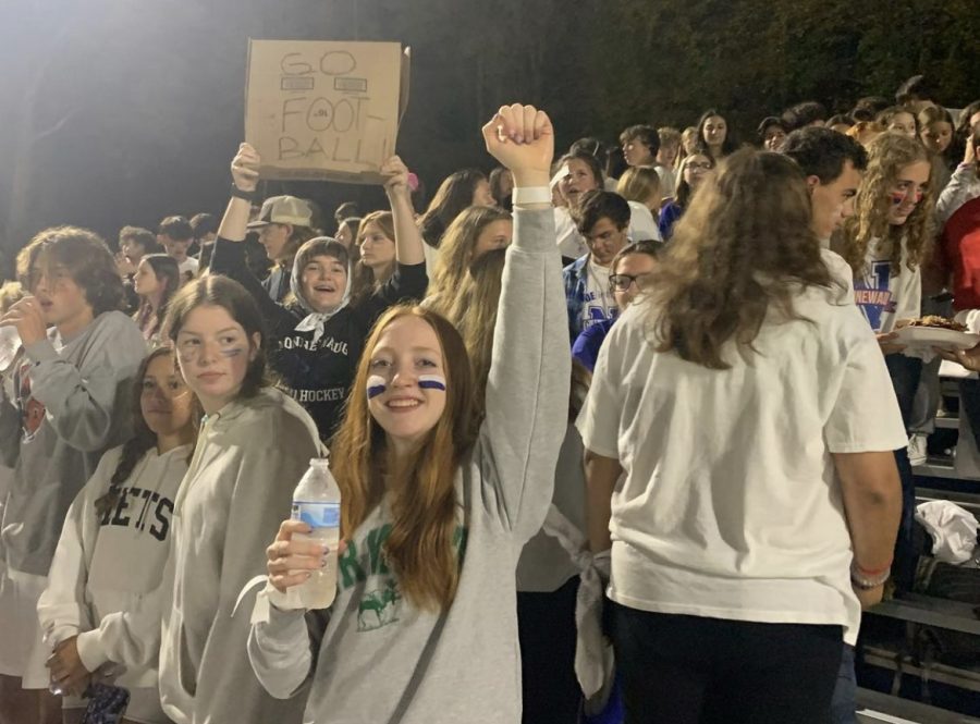 Students+cheer+for+the+football+team+during+the+homecoming+game+on+Oct.+14.+The+student+section+was+loud+and+helped+contribute+to+the+win+by+keeping+spirits+high+--+a+key+to+the+Nonnewaug+sports+success.