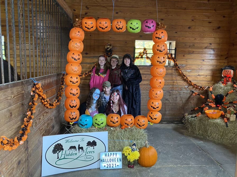 NHS students participate in local farm, Hidden Acres, Halloween event. 