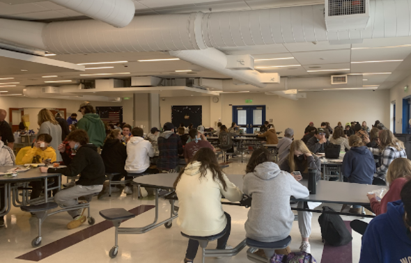 Students gather in the cafeteria to enjoy their time with friends without feeling barricaded by dividers. 