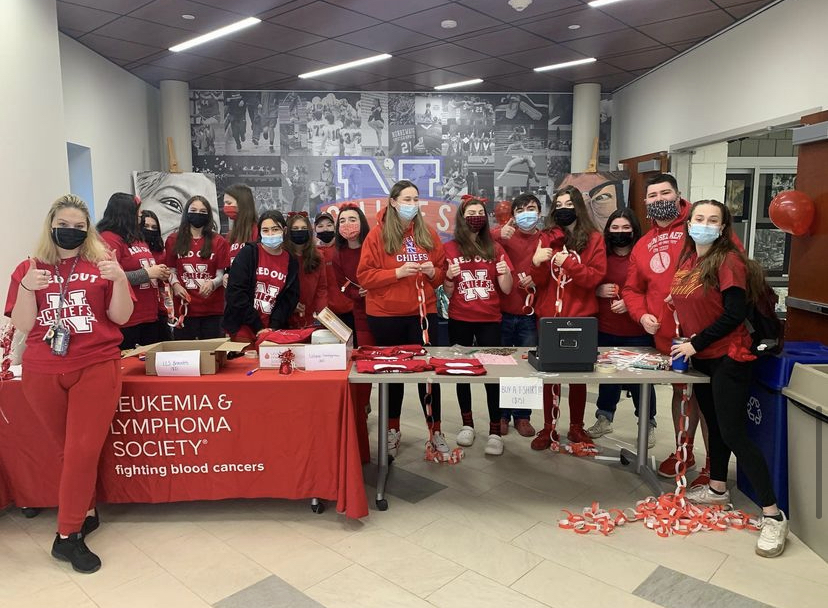 Students fundraising for the LLS during Fridays red-out. 