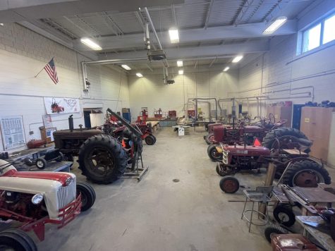 NHS student tractors in the NHS mechanics shop after a tune up educational. 