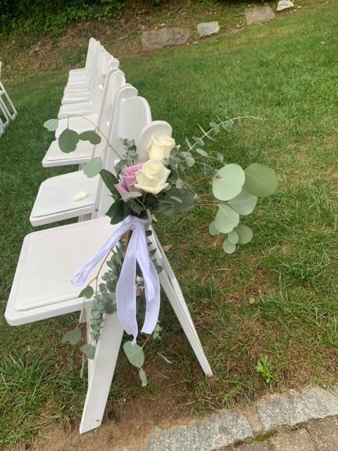 The floriculture class didnt make just centerpieces or bouquets. They made different arrangements like this one, hanging off the chair during the ceremony.