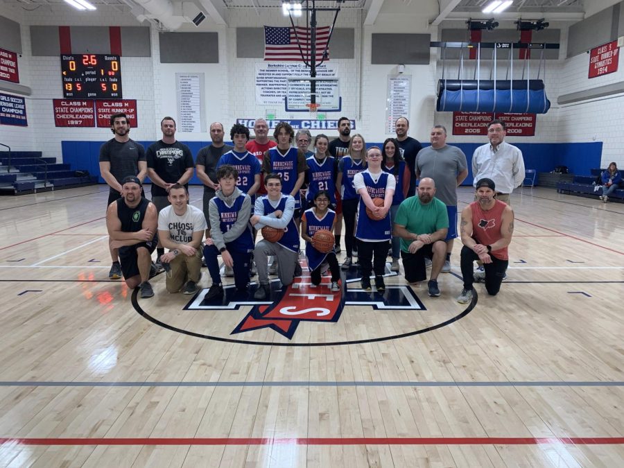 Last year’s Unified basketball team poses group photo after their annual faculty basketball game.