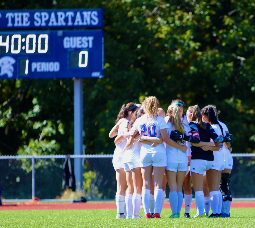 The Nonnewaug girls soccer team huddles up prior to its 6-0 win against Shepaug on Oct. 8. The Chiefs finished the regular season 15-1 to earn the top seed in the Class L state tournament.