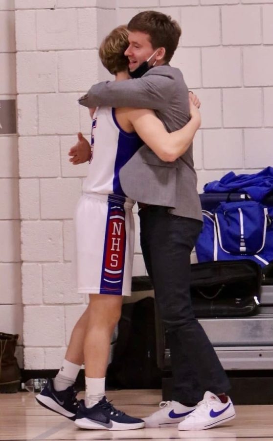 Nonnewaug assistant coach Kyle Fitzpatrick, right, hugs Ben Conti during a game last season.