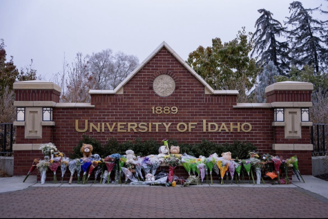 Memorial flowers and gifts line the University of Idaho entrance to mourn the four students who were stabbed to death in November. The killer has not been identified.