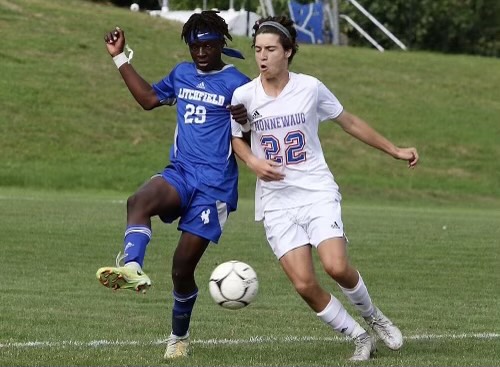 Azem Frangu, right, and Benjamin Mwanza battle for the ball on Litchfields turf during the first Nonnewaug vs. Litchfield game in the 2022 soccer season.