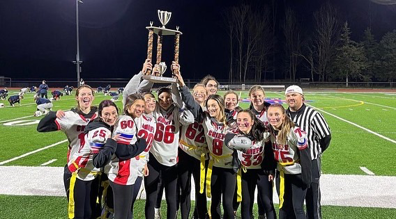 The Class of ‘24 hoists the trophy up in the air post-Powderpuff game.