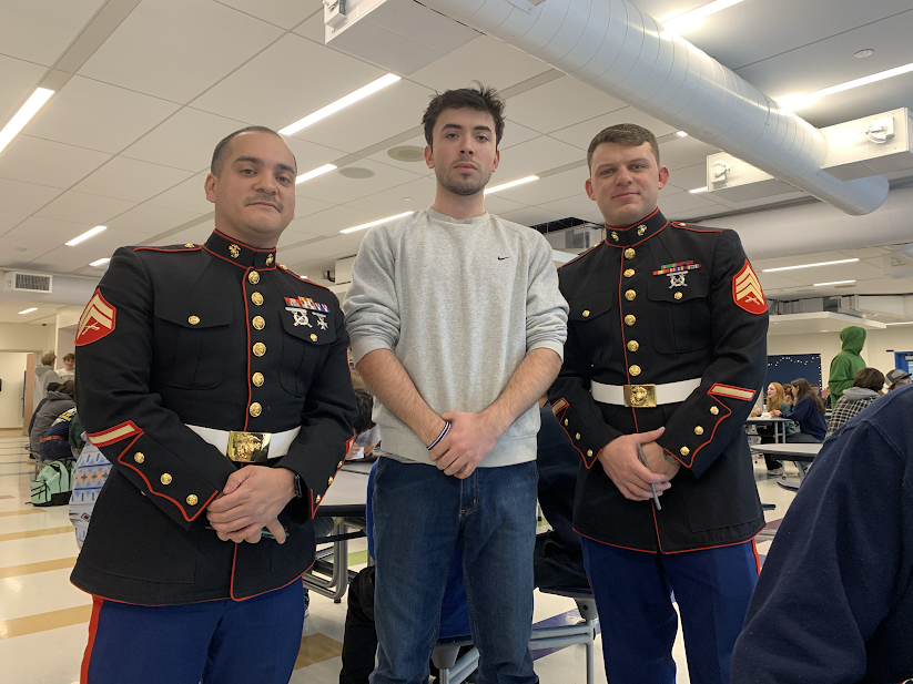 Emmet Ray, center, standing with current United States Marines that he hopes to be working with in the future to continue the family legacy.