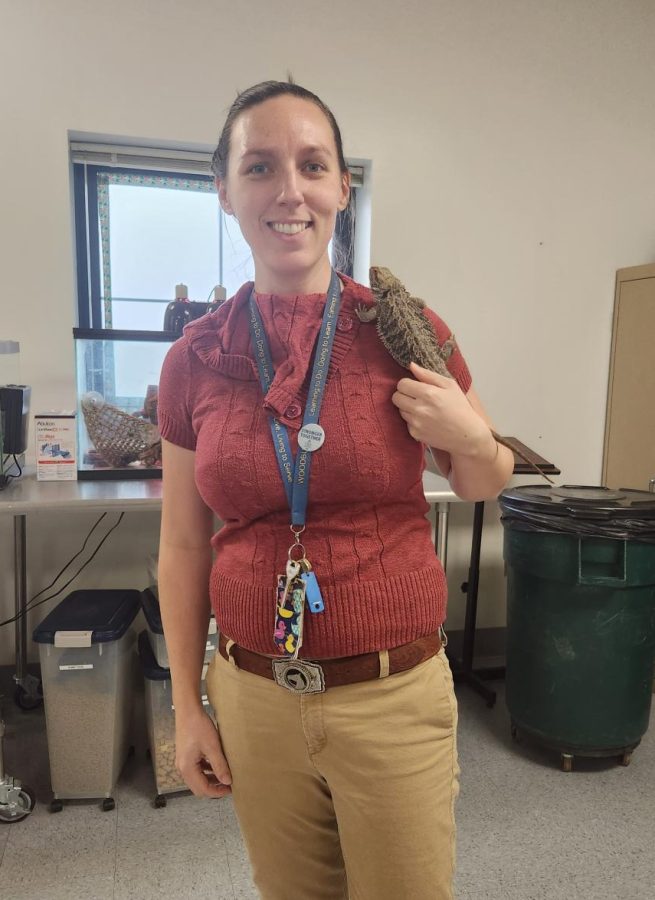 Jennifer Jedd poses with one of the reptiles that reside in the small animal lab.