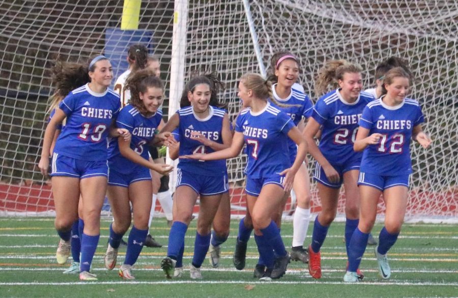 Teammates celebrate a goal by Layla Coppola (4) during the Berkshire League tournament.