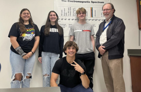 2022-23 Team Beta members, from left, Leah Quijano, Anna Galvani, Jacob Wells, Dan Foster, and advisor William Pease, held the first meeting of the year in September.