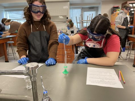 Students in AP Chemistry work to mix a variety of solutions to watch how the chemicals react to each other. This course is one of the most rigorous at Nonnewaug and help prepare students for their futures in science.