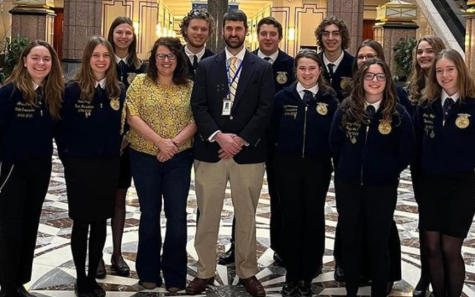 Agriscience Director Ed Belinksky stands with current FFA students at the Connecticut state capital. 