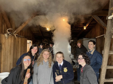 Students in the natural resources class take part in their first week of boiling down sap to make syrup. From left, Jason Suess, Joe Velky, Colin Frechette, Thomas Faull, and Gianna Lodice. (Woodbury FFA)