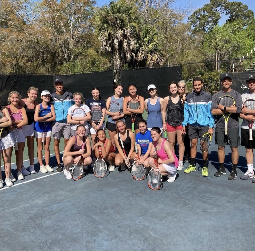 The girls tennis team poses with trainers from the Van Der Meer tennis camp in Hilton Head, South Carolina. (Noreen Chung)