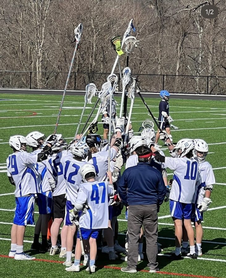 The+Nonnewaug+boys+club+lacrosse+team+huddles+up+last+season.+This+year%2C+many+of+those+players+are+playing+on+the+first+Northwest+United+lacrosse+team.+%28contributed%29