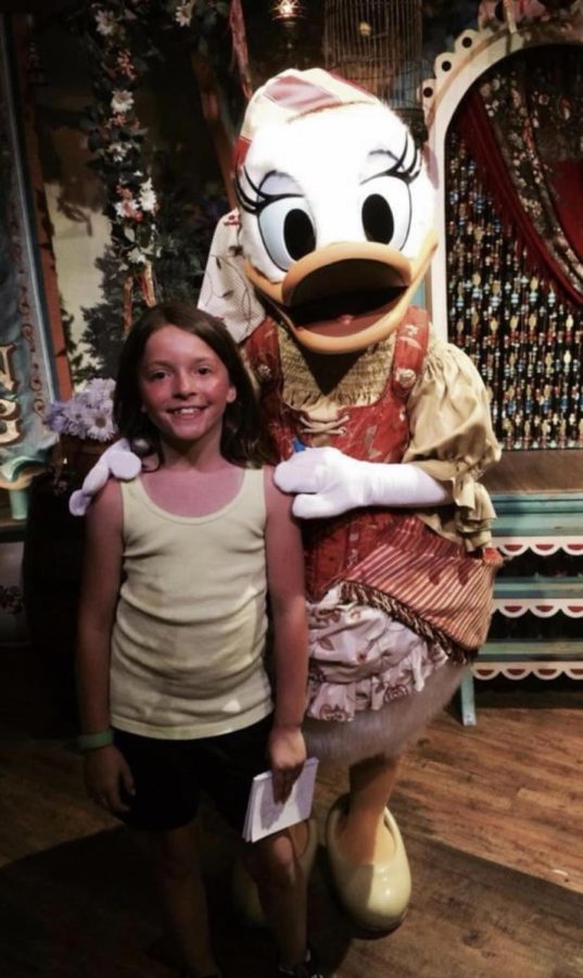 Madelynn Orosz poses with Daisy Duck in the circus tent in Fantasy Land at the Magic  Kingdom Park in 2014. Orosz has been to Disney World 5 times in her life, and enjoys going every time. 