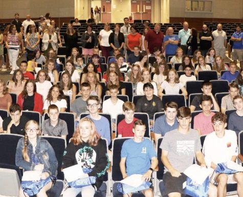 The Class of 2023 sits in the auditorium at freshman orientation in 2019.
