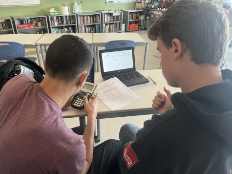 Devon Zapatka, left, and Kevin Comerford study for their upcoming exams. These students are helping each other understand different mathematical equations to better help them prepare for these tests.
