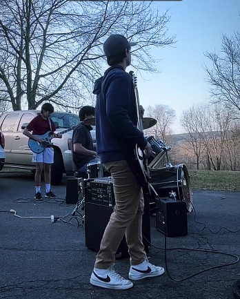 The Good Hill Band takes their practices outside to enjoy the summer while perfecting their craft.