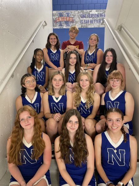 The new and improved Nonnewaug cheer team poses and is set for the 2023-24 season. With only three members last year during the fall season, the strong group of 14 is ready for what comes their way. 