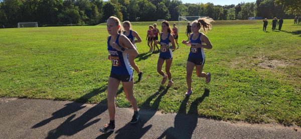 The girls cross country team warms up for their race at Black Rock State Park on Sept. 12. Nonnewaug won against both Thomaston and Terryville even though the Chiefs only have five girls on the team.