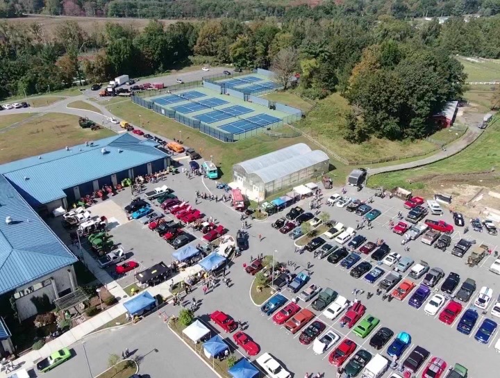 The parking lot is filled Oct. 1 during the Woodbury FFA Alumnis inaugural Kickin Country Car Show. More than 210 vehicles participated.