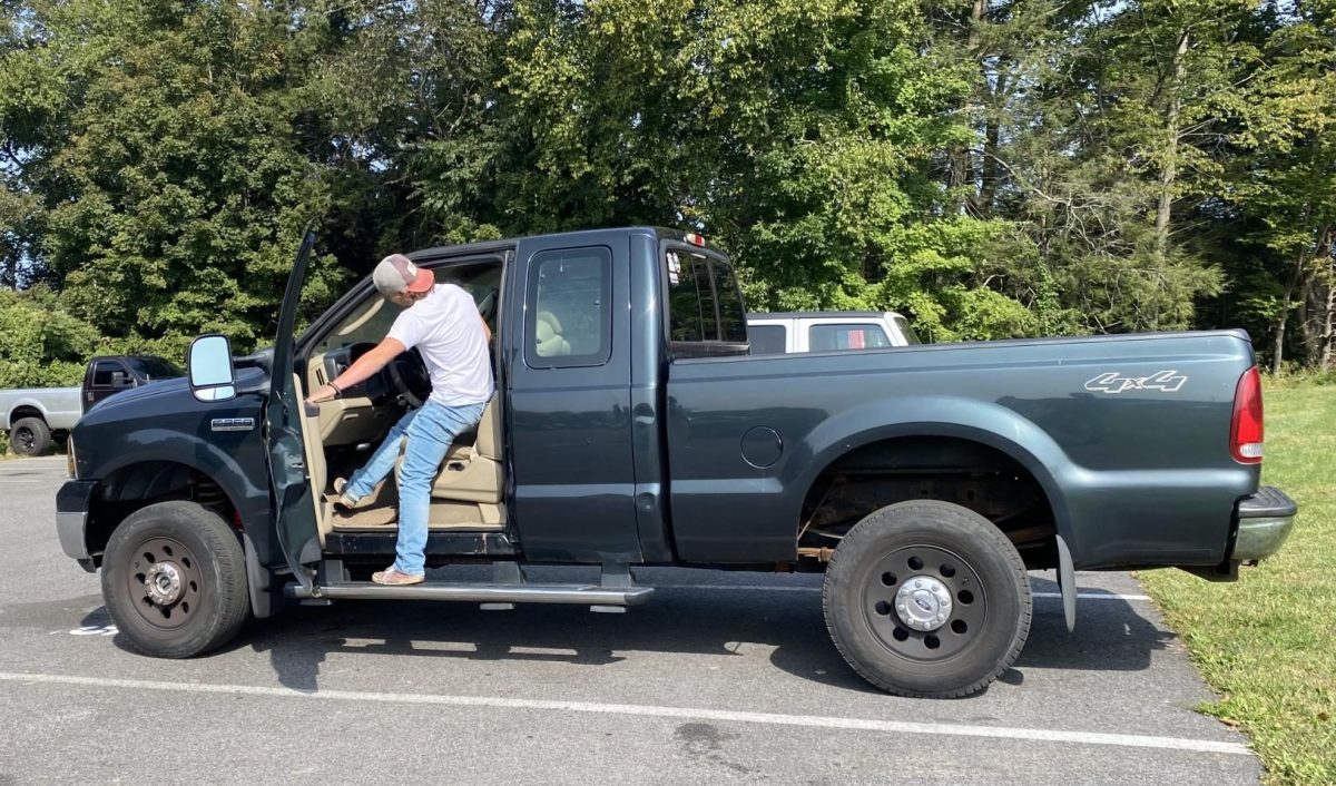 Daniel Coyle gets into his truck as he prepares to leave during fifth period. Coyle, a junior at Nonnewaug, completed his requisite MBLE steps to earn leave and return privileges.