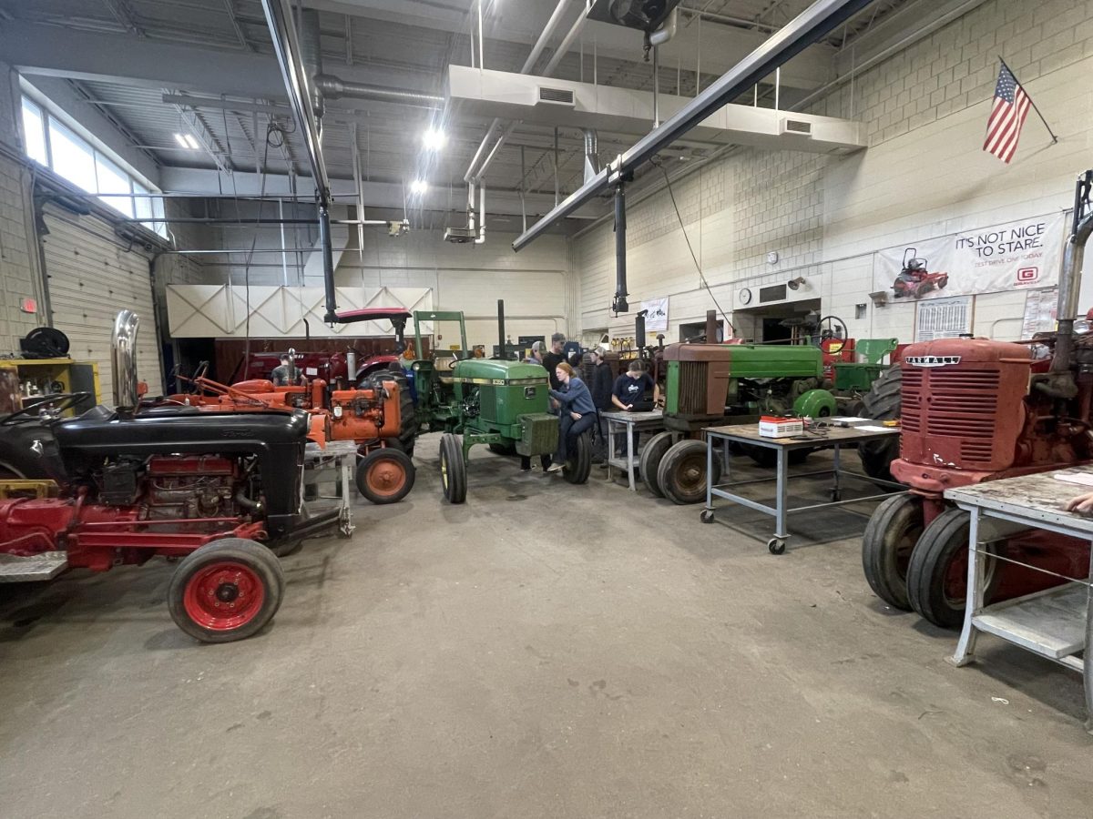Farm tractors sit in the shop at Nonnewaug. Ag mechanics students get to bring in their tractors to get worked on by other students.
