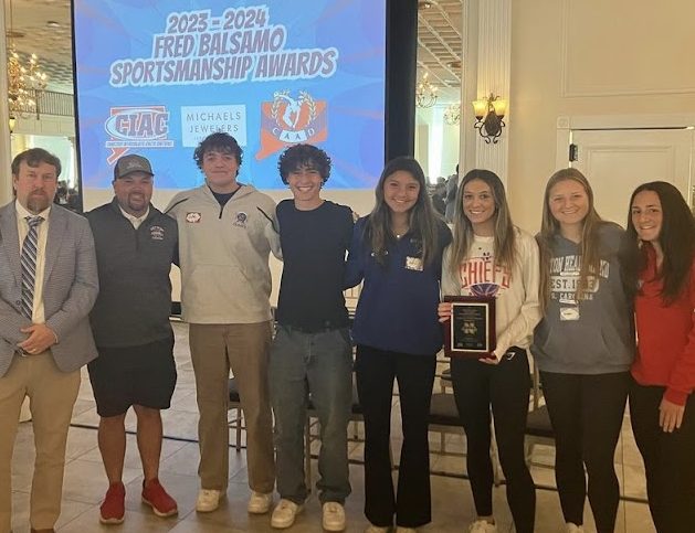 Nonnewaug’s Athletes Council representatives, right, and advisors Declan Curtin, left, and Kyle Brennan pose for a picture after receiving the Fred Balsamo Award for sportsmanship at the CIAC Sportsmanship Conference at the Aqua Turf on Oct. 3. (Courtesy of the CIAC)