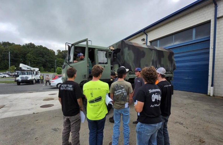 Andrew Zielinski (in truck) shows his ag mechanics class how to start and operate the military truck. 