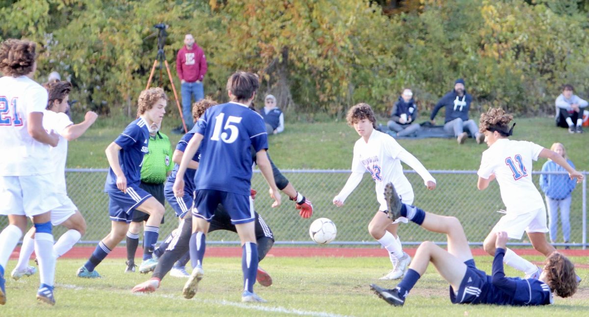 Nonnewaugs Azem Frangu (22) pursues a loose ball in the box during a game last season at Shepaug. The schools rivalry is often headed on the soccer field.