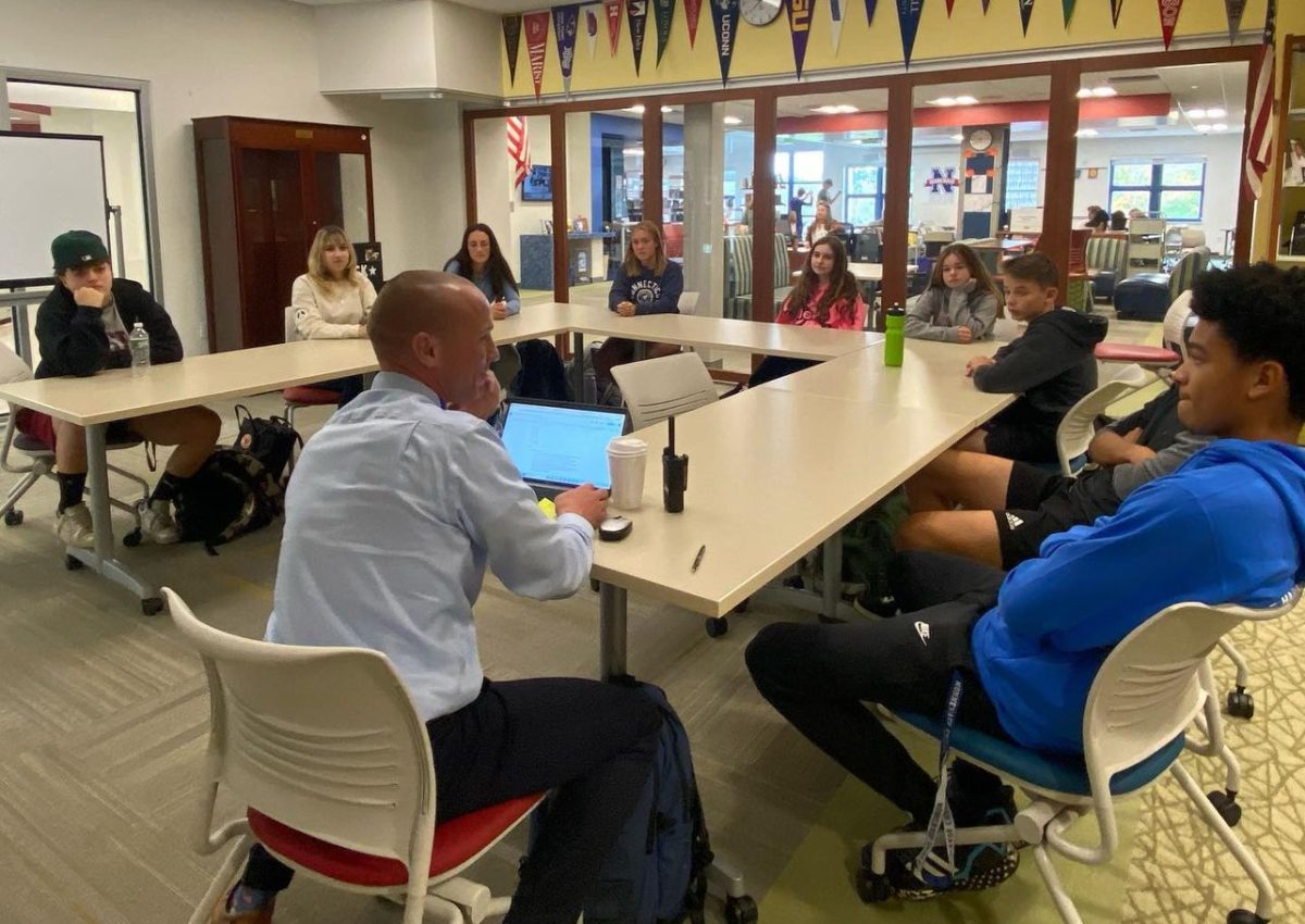 Nonnewaug principal Mykal Kuslis listens to the Principals Student Advisory make their suggestions and types them into a Google Doc during the groups first meeting. This new group of students from every class strives to improve the NHS environment.