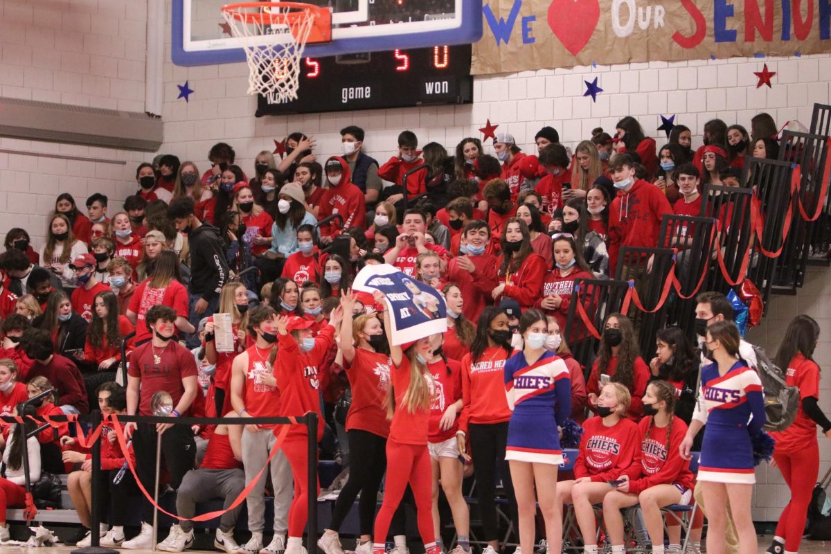 The Nonnewaug student section dresses in red vs. Shepaug in 2021. The redout theme supports the Leukemia and Lymphoma Society. (Courtesy of Noreen Chung)