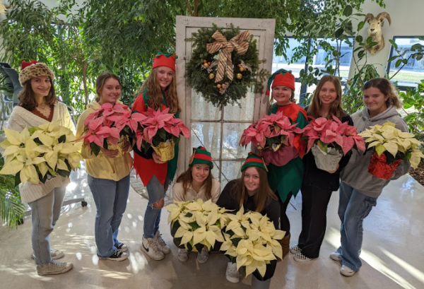 NHS Floriculture students kick the holiday spirit with the annual plant sale. Pictured is last years members. Amy Byler (left), Hannah Searless, Alyssa Calabrese, Juliann Noyd, Lily McDonald, Nora Galvin, Jamie Paige, Bianca Gracia. 