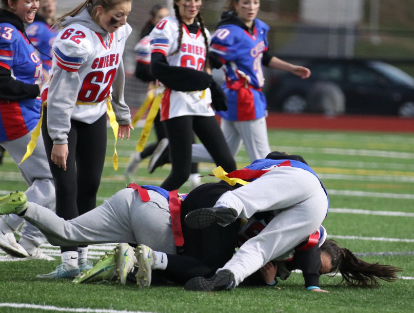 A ball carrier gets tackled during the inaugural Nonnewaug powderpuff game last November. Many are looking forward to the action-packed game’s return – hopefully without the tackle aspect – which will see the Class of 2024 face off against the Class of 2025.