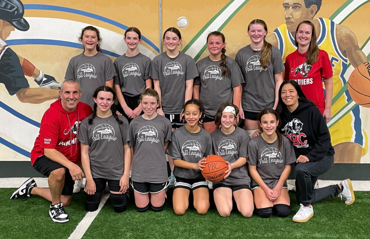 Rebecca+Trzaski%2C+back+right%2C+and+her+daughter%2C+Katelyn%2C+third+from+left+in+the+back%2C+pose+after+a+fall+season+basketball+camp.+Its+one+of+the+many+basketball+activities+that+Trzaski+has+pulled+together+to+offer+more+opportunities+for+young+girls.+%28Courtesy+of+Rebecca+Trzaski%29
