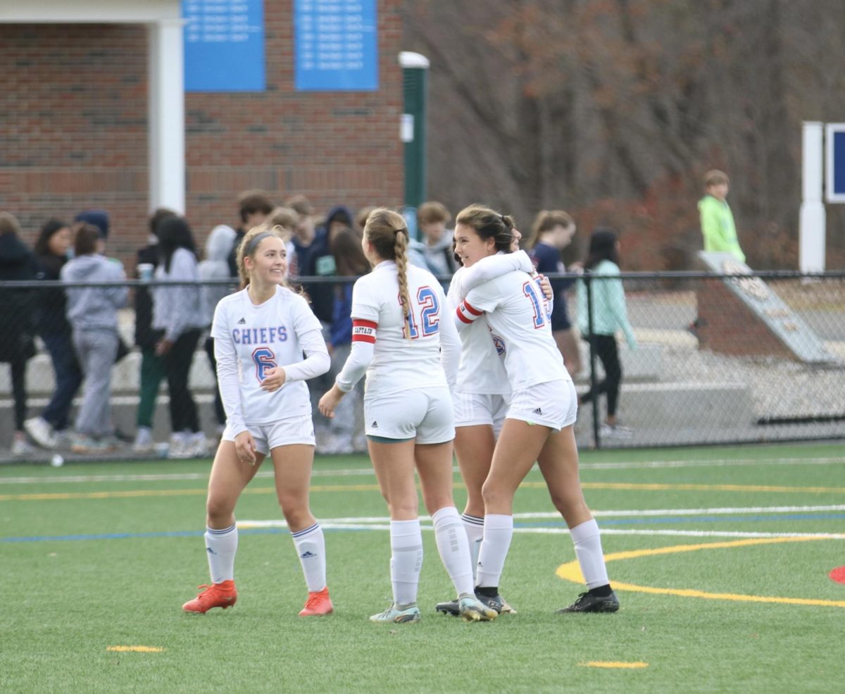 Skylar Chung, right, with Molly Hartmann, left, and Maylan Hardisty (12) embrace during the Nonnewaug girls soccer teams Class M quarterfinal game at Suffield.