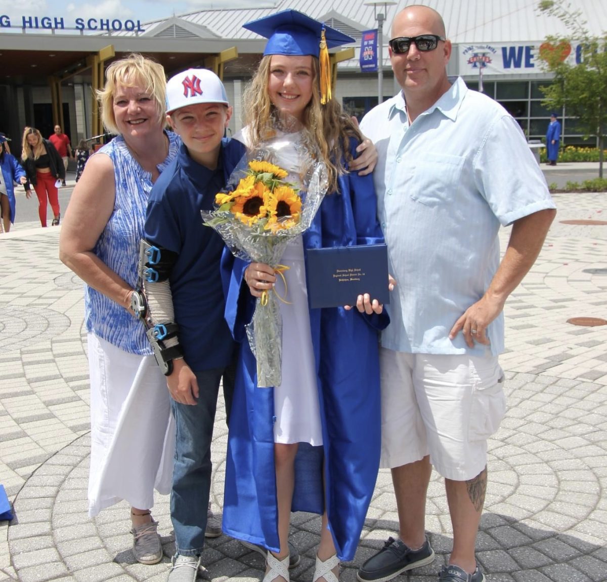 From left, Kim Calabrese, Billy Calabrese, Allysa Calabrese, and Billy Calabrese smile after the 2023 graduation when Allysa graduated from Nonnewaug. (Courtesy of Kim Calabrese)
