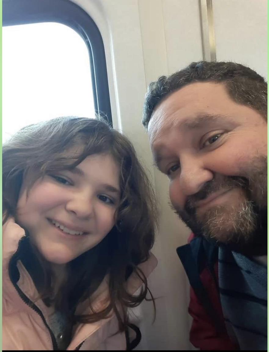 Faith Lally and her Father smile for a picture on the way to the show “Wicked”.