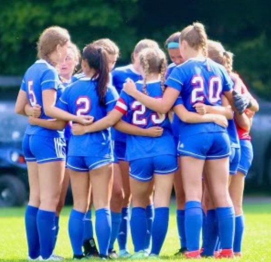 22 Nonnewaug girls soccer team huddle before a game. Ellie McDonald(2) and her best friend Katie Farrell(5) have played soccer together since their freshman year.