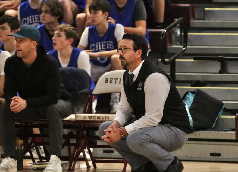 Nonnewaug+boys+basketball+head+coach+Tim+Fitzpatrick%2C+right%2C+and+assistant+coach+Kyle+Fitzpatrick+on+the+sidelines+during+a+matchup+at+Bethel+High+School+earlier+this+season.